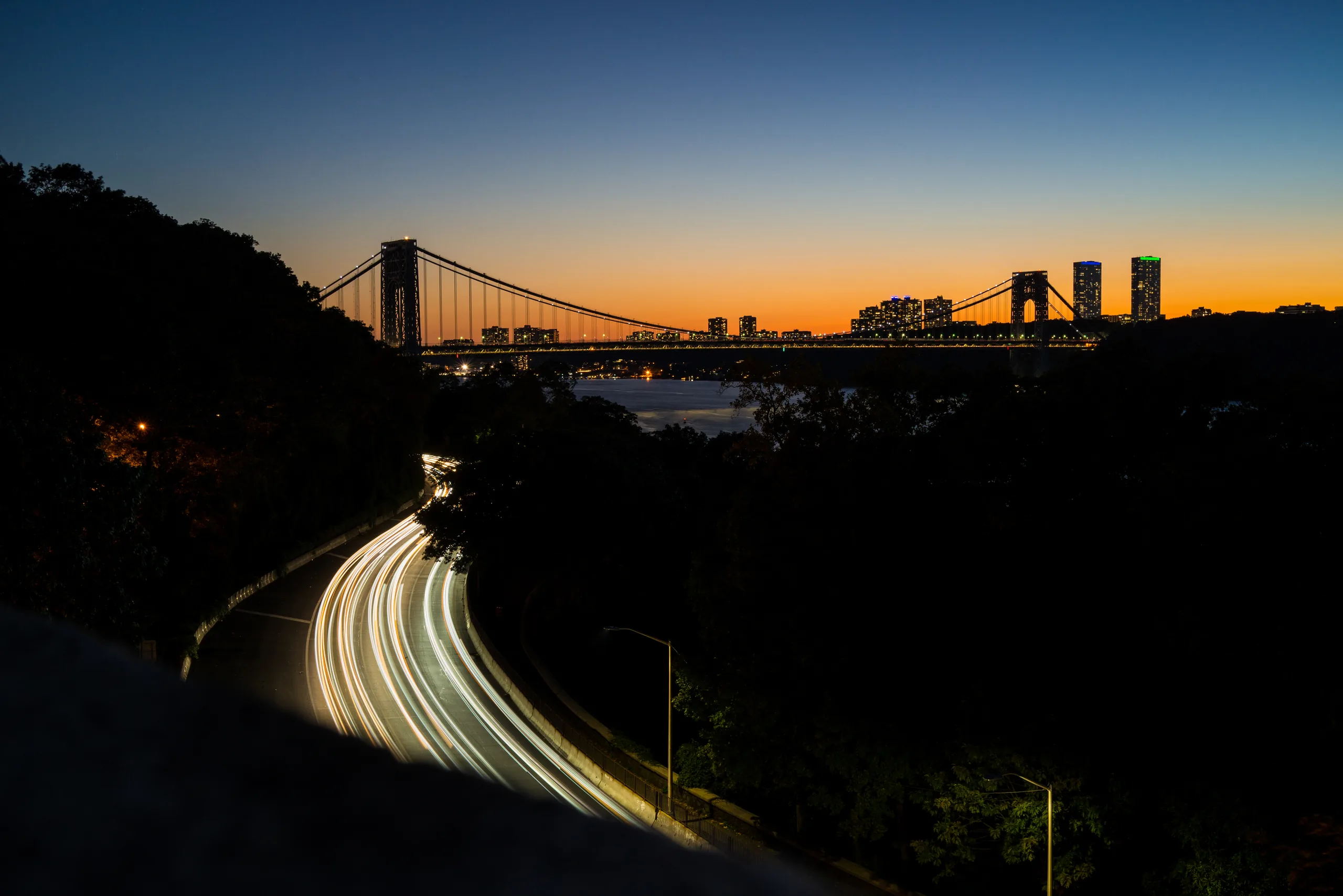Traffic lighttrails and George Washington Bridge with Hudson River