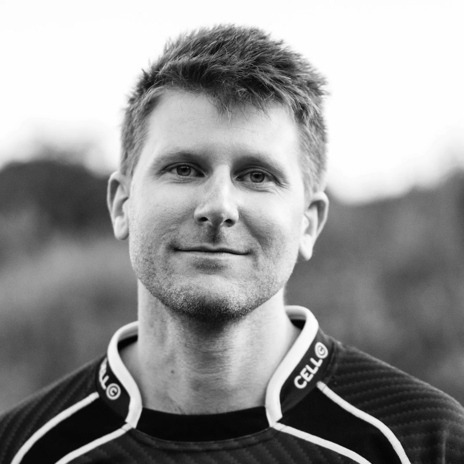 Chris Kelly, a black-and-white outdoor portrait